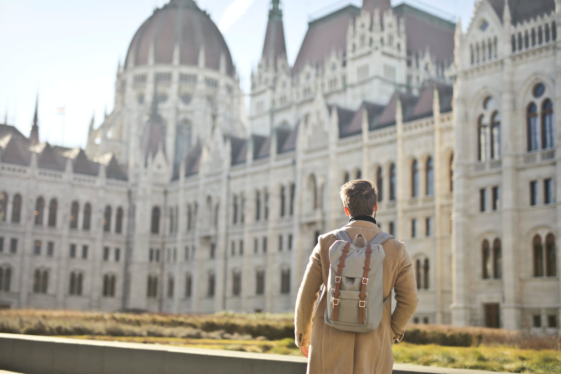 tourist in front of hungarian parliament building