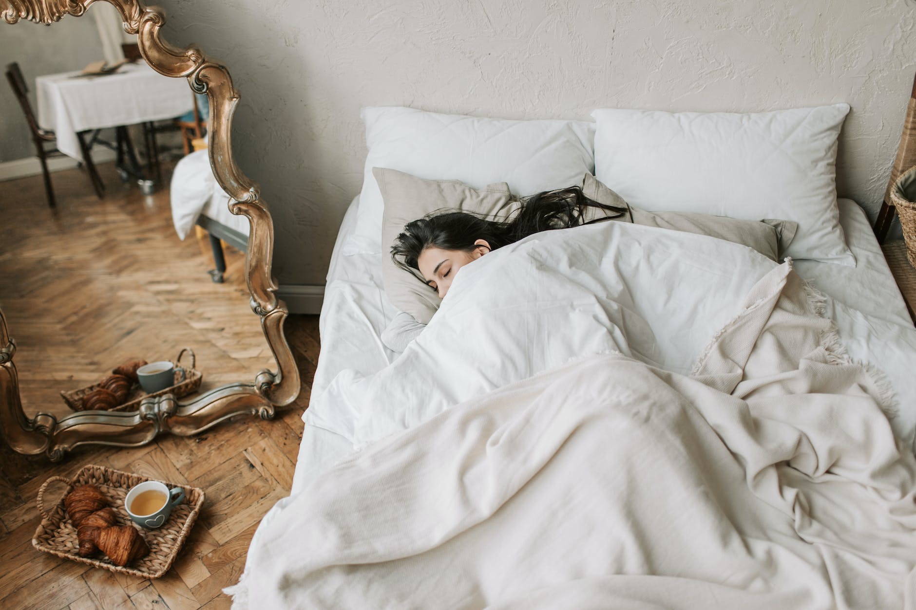 a woman sleeping on bed