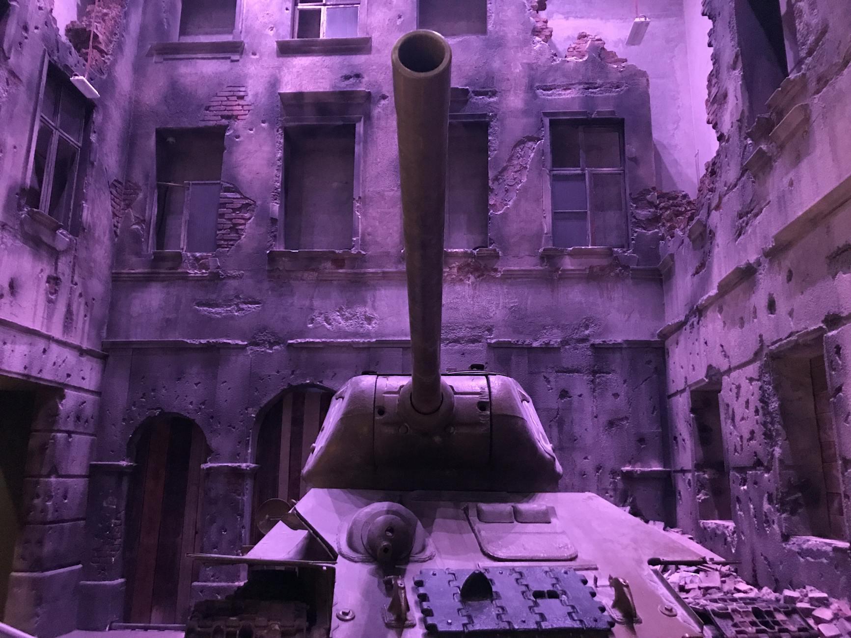 battle tank near concrete structures