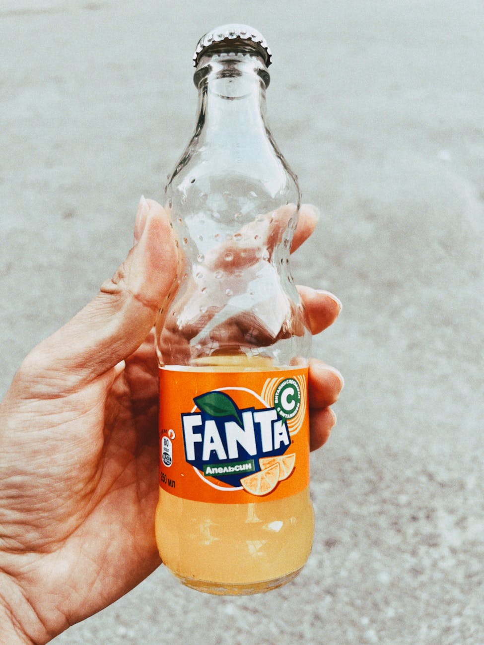 hand holding fanta bottle