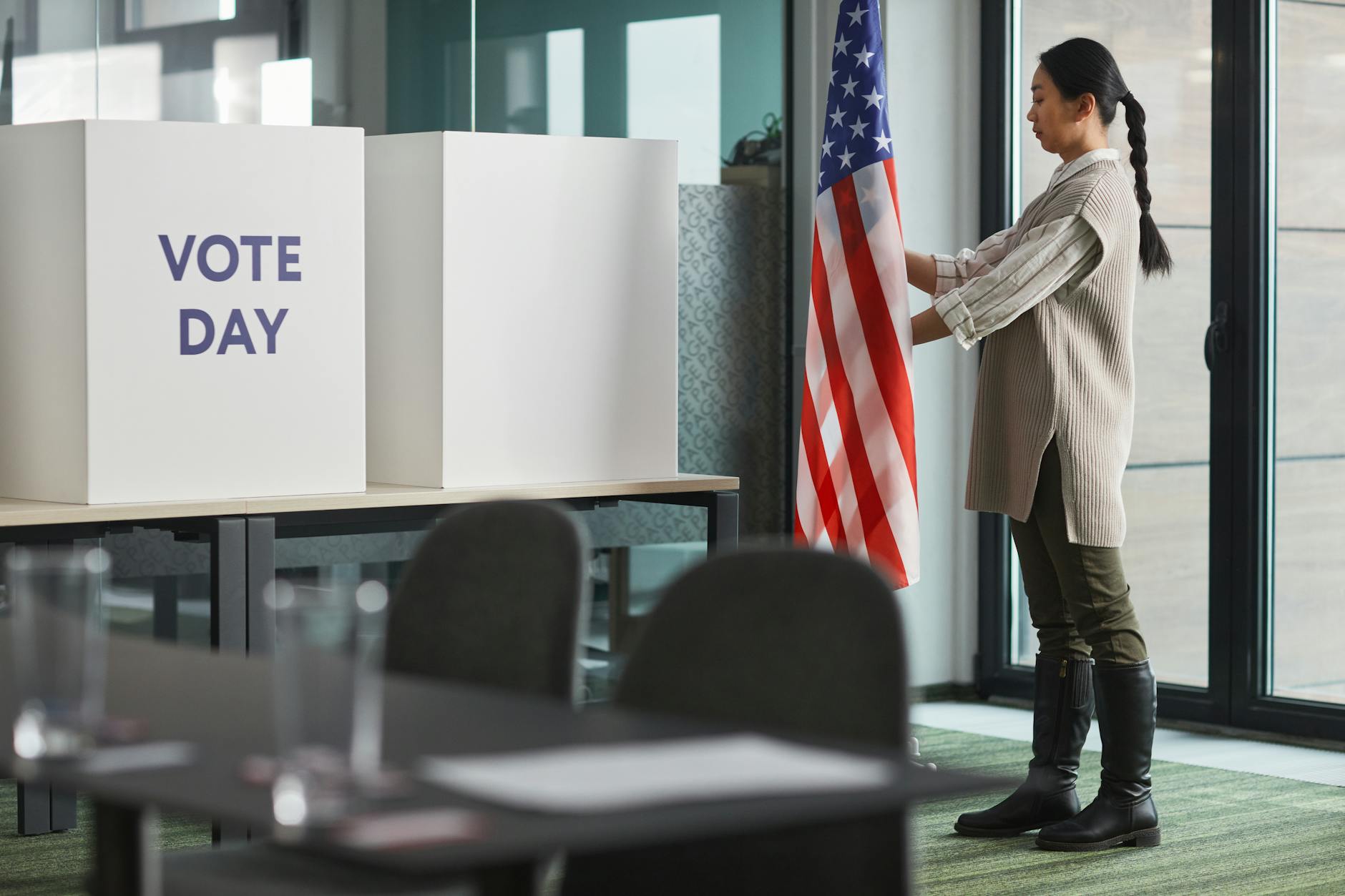 woman standing near american flag